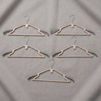 Sturdy plastic clothes hangers for daily wardrobe use