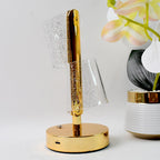 Golden base crystal LED double shade table lamp illuminating cozy room