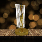Crystal table lamp softly glowing with intricate LED cascade pattern