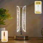 Crystal table lamp with golden base and acrylic crystal shade illuminating warm LED glow