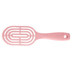 Men's hair brush held comfortably in hand, demonstrating easy grip.