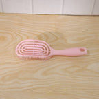 Vented design of the hair brush assisting in faster blow-drying.