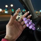 Child-friendly cartoon cloud keychain with a small bell and a metal clip.