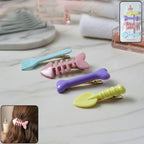 Set of four colourful cartoon hair clips for girls with animal and fruit designs.