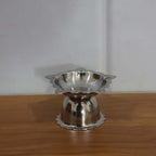 Silver-toned stainless steel sunflower diya for pooja and aarti rituals