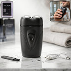 Close-up of portable electric shaver with dual rotary heads for men