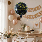 Angled view of black foil birthday balloon