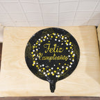 Party-ready black foil balloon for birthday festivities