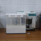 The 3-in-1 wall-mounted cereal dispenser in action, dispensing lentils.
