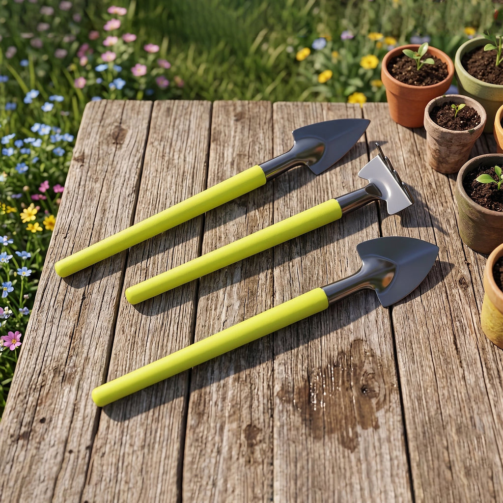A person using the Mini Gardening Tool Set for planting a small seedling.