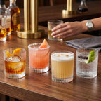 Crystal glass tumbler set with ribbed design and sturdy base