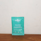 Pollic Kadam Glass & Mirror Cleaner sachet displayed with fresh product background