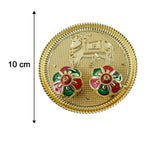 Golden pooja thali with cow motif for tilak and rituals