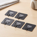 Clear sticky hooks for hanging towels, keys and utensils