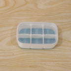 Compact home ice tray in use, perfect for small freezers and daily needs.