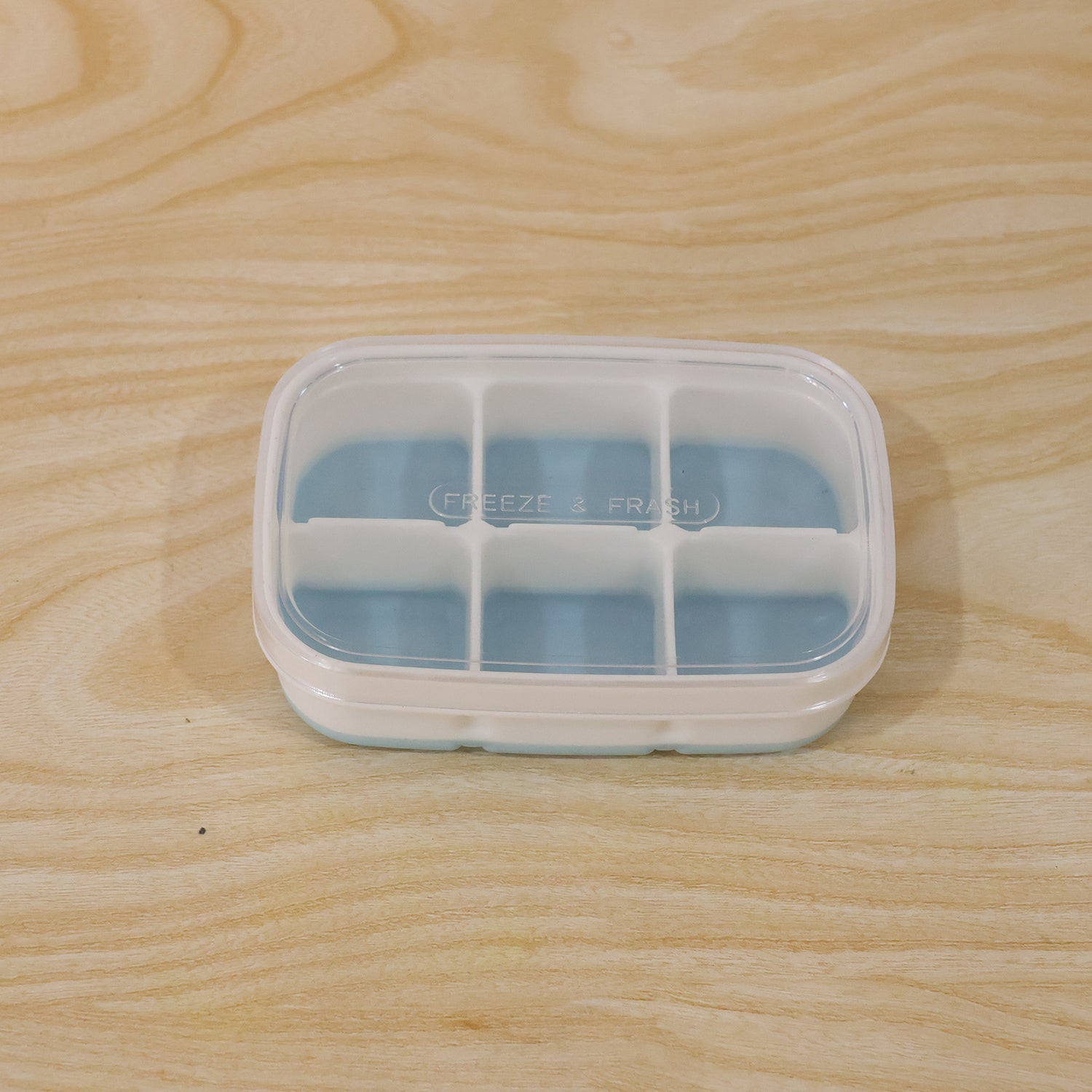 Compact home ice tray in use, perfect for small freezers and daily needs.