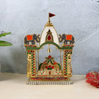 Festive pooja mandir swing with vibrant enamel and hanging bell