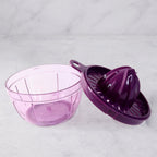 Manual juicer base and container for fresh citrus juice collection