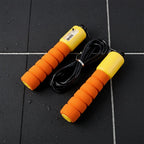 Adjustable fitness jump rope coiled for portability and easy storage