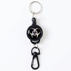Durable retractable keychain securely clipped onto a fabric strap.