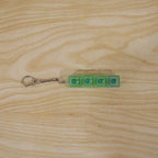 Small gadget key holder with tactile click and LED glow