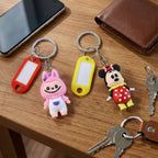 Customizable name tag on cartoon character keychain charm