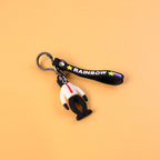 Detailed view of rainbow strap on cartoon man keychain accessory