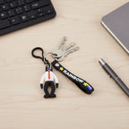 Cartoon key ring hanging from backpack zipper adding a colorful accent