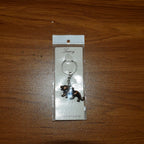 Metal lion keychain attached to car keys for daily use and organization