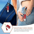 Open faux leather sanitizer holder keychain showing clear refillable bottle