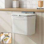 Wall mounted kitchen dustbin attached to cabinet door