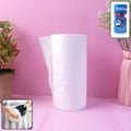 Single white sheet from a kitchen paper towel roll showing super absorbency and soft texture