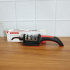 An Indian user demonstrates the manual knife sharpener on a steel blade.