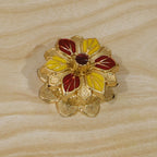Traditional golden kumkum box for temple worship