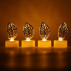 Side view of a golden leaf LED candle, demonstrating its battery compartment and on/off switch.