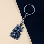 Detailed view of Trishul Damru symbols on keychain