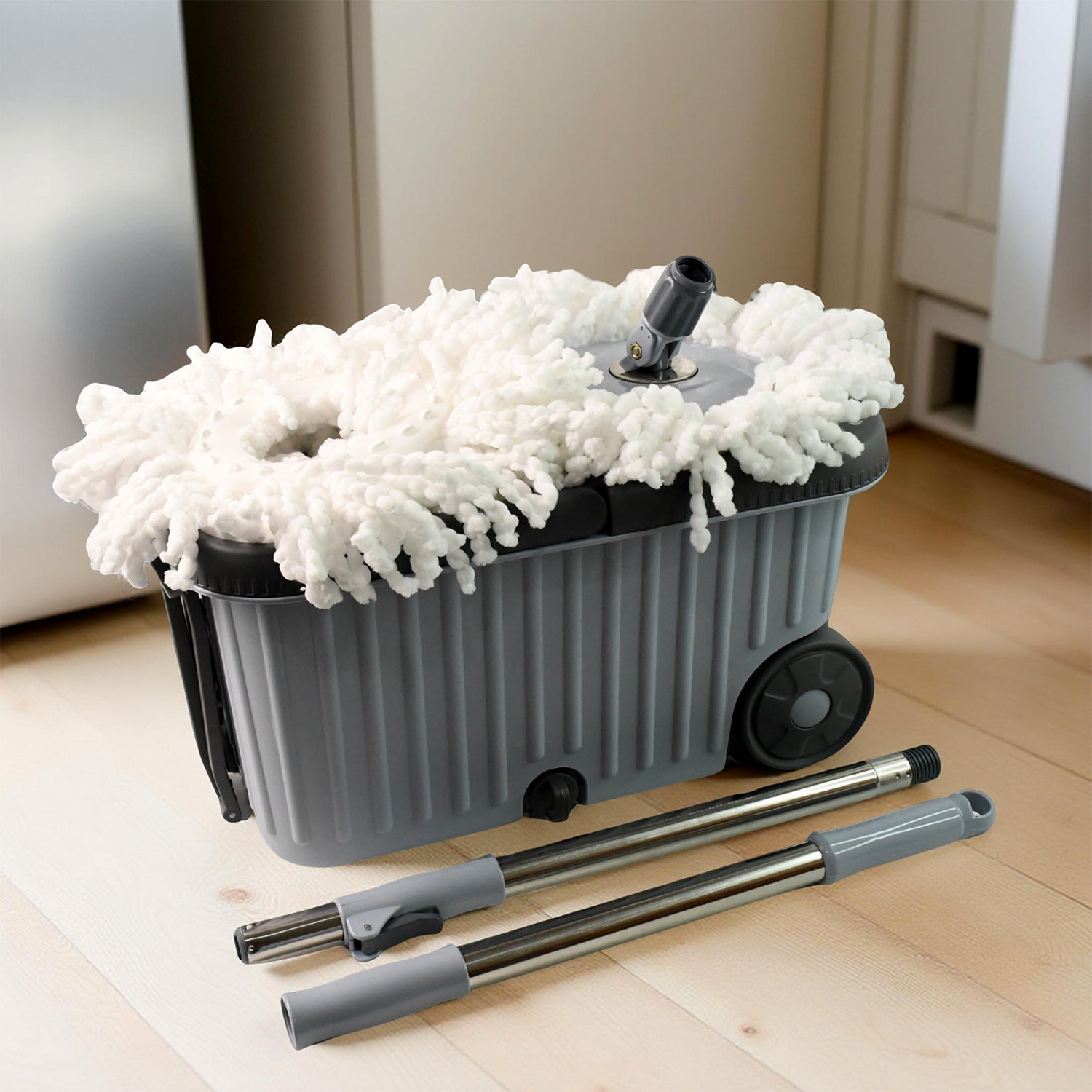 Spin mop system on wheels with dual chamber bucket for efficient cleaning