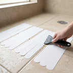 Safe bathroom surfaces improved by transparent anti-slip strips