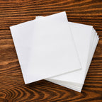 White disposable napkins ideal for restaurant and catering services.