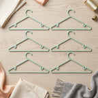 Close-up of durable plastic garment hanger with non-slip grip