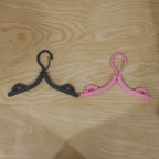 Bright colored foldable hanger designed for organizing wardrobe efficiently