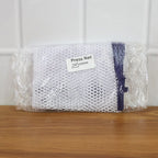 Ironing mesh press cloth safeguarding delicate patterned garment during ironing