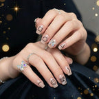 Close-up of stylish glossy false nails with a trendy design.