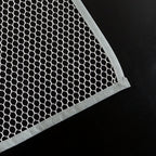 Hand holding the lightweight Large Ironing Press Net mesh protector cloth
