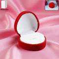 Heart-shaped velvet jewellery ring box in elegant red velvet exterior