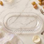 Glass snack tray with oval shape and beaded border