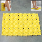 Close-up of suction cups beneath anti-slip bathroom massage mat