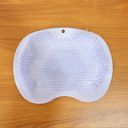Purple silicone bath massage cushion showing flexible bristles and suction cups
