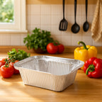 Close-up of aluminium food container showing ridged sides for strength
