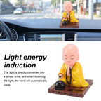 Meditation pose Buddha statue with solar activated gentle movement